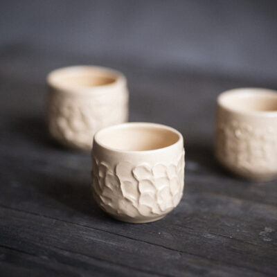 textured beige handmade ceramic cup